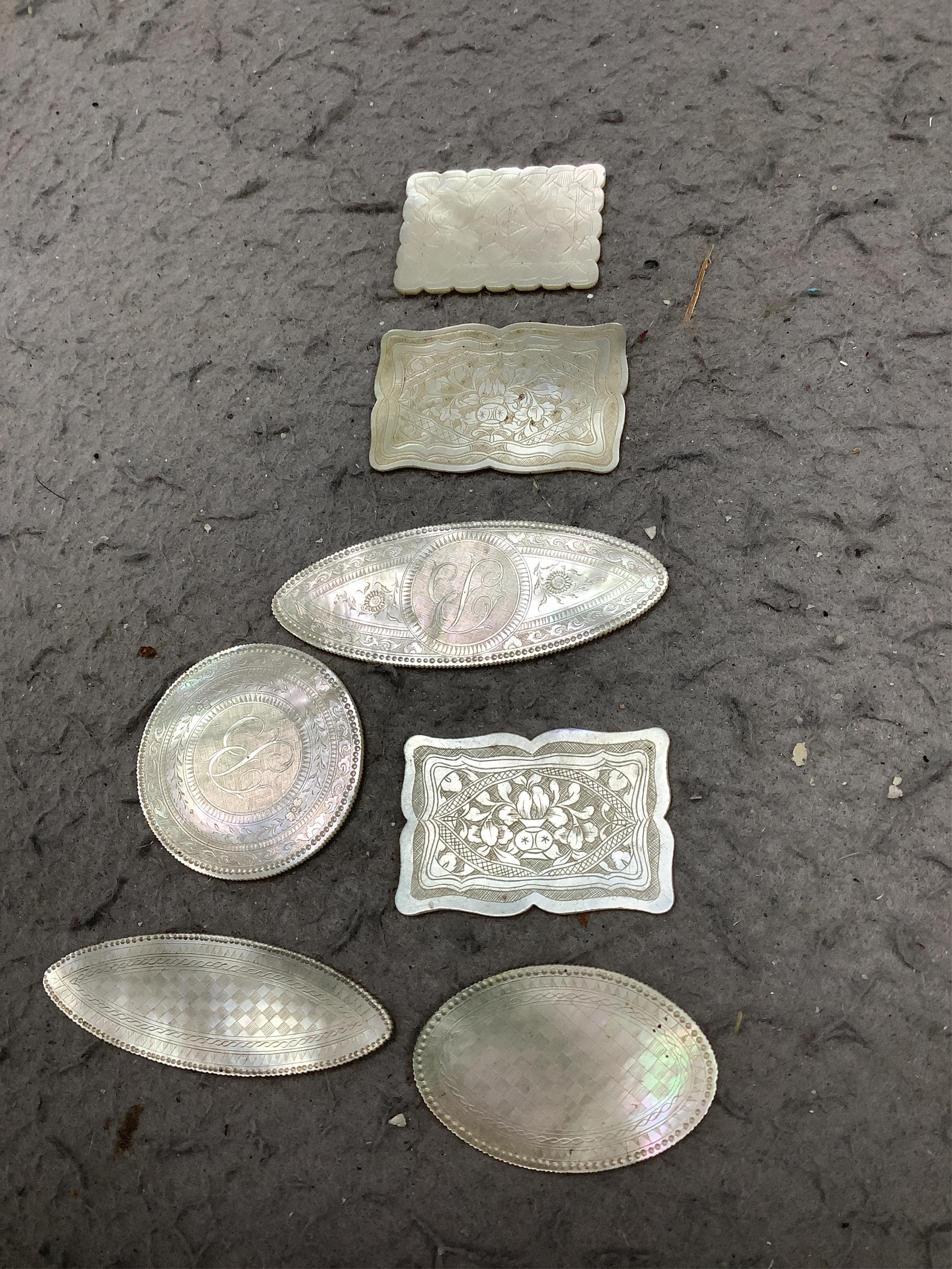 An extensive collection of Chinese mother of pearl gaming counters, in an album. Condition - the majority of the counters in good condition, occasional examples with tiny splinter edge chips